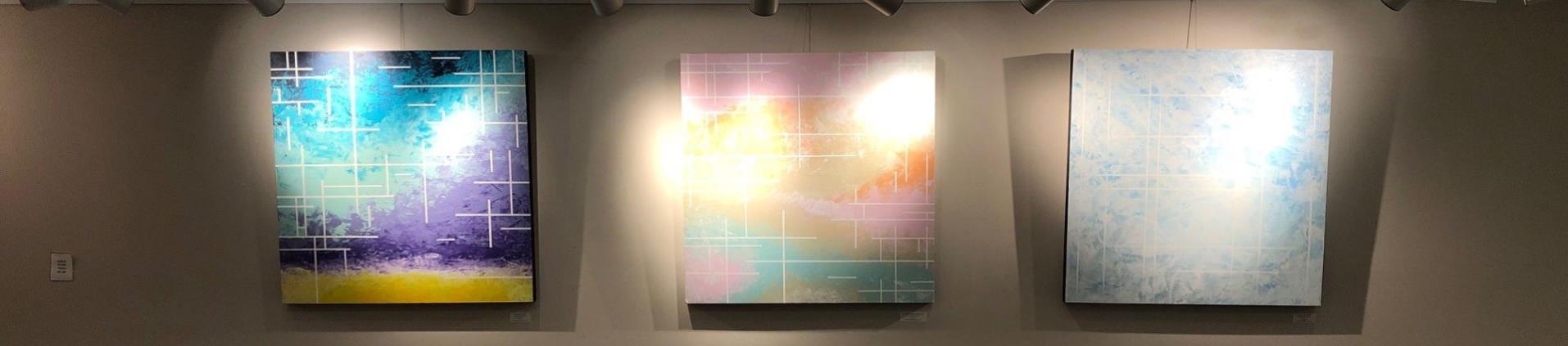 GPAC Art Gallery showing three colorful abstract works in pastel colors